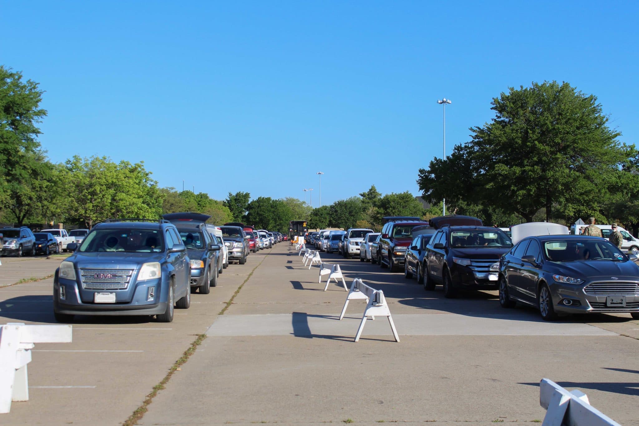 Cars lined up at Fair Park to recieve food from a North Texas Food Bank Mobile Pantry distribution