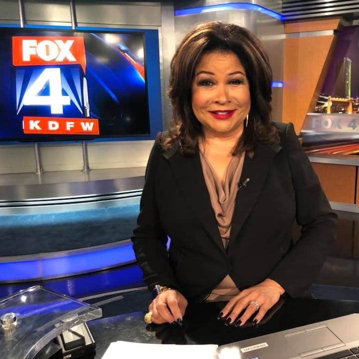 Clarice Tinsley sitting at a news desk at Fox 4