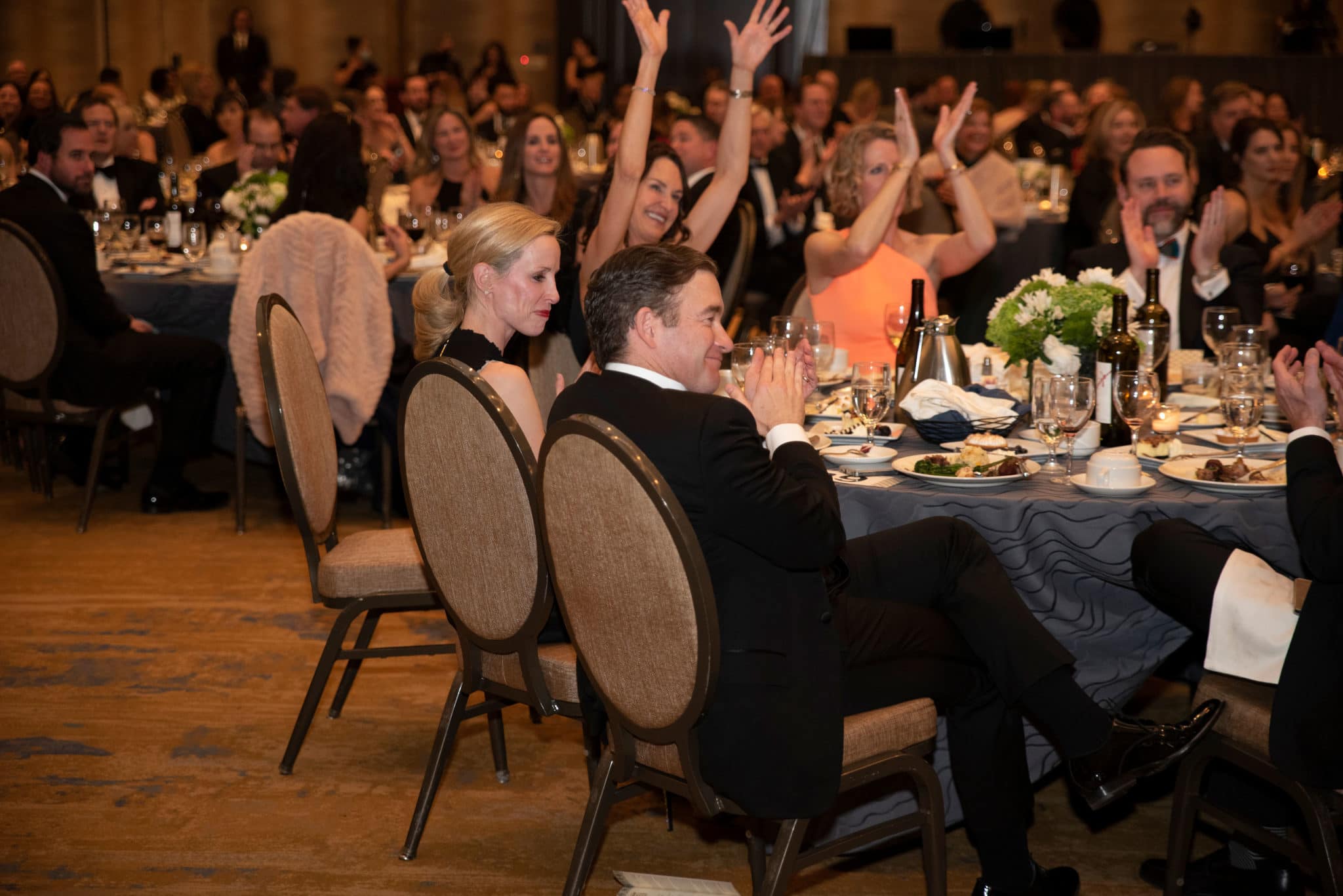 Guests celebrating during the Harvest live auction