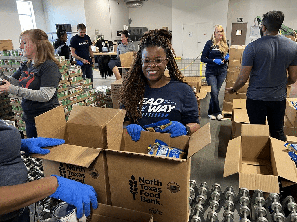 Volunteer from Lead The Way Packing Box