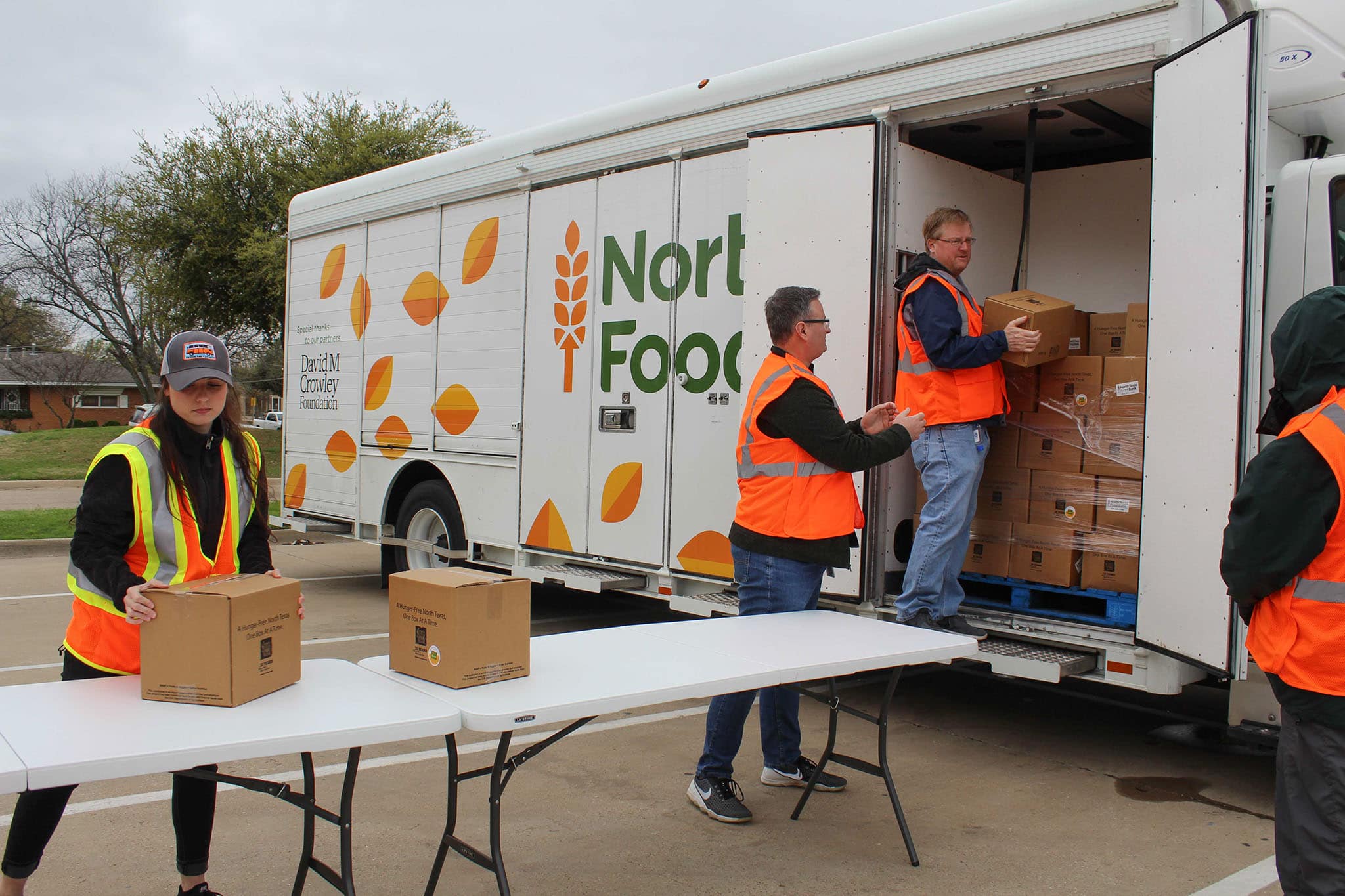 Volunteers Unloading Food Boxes