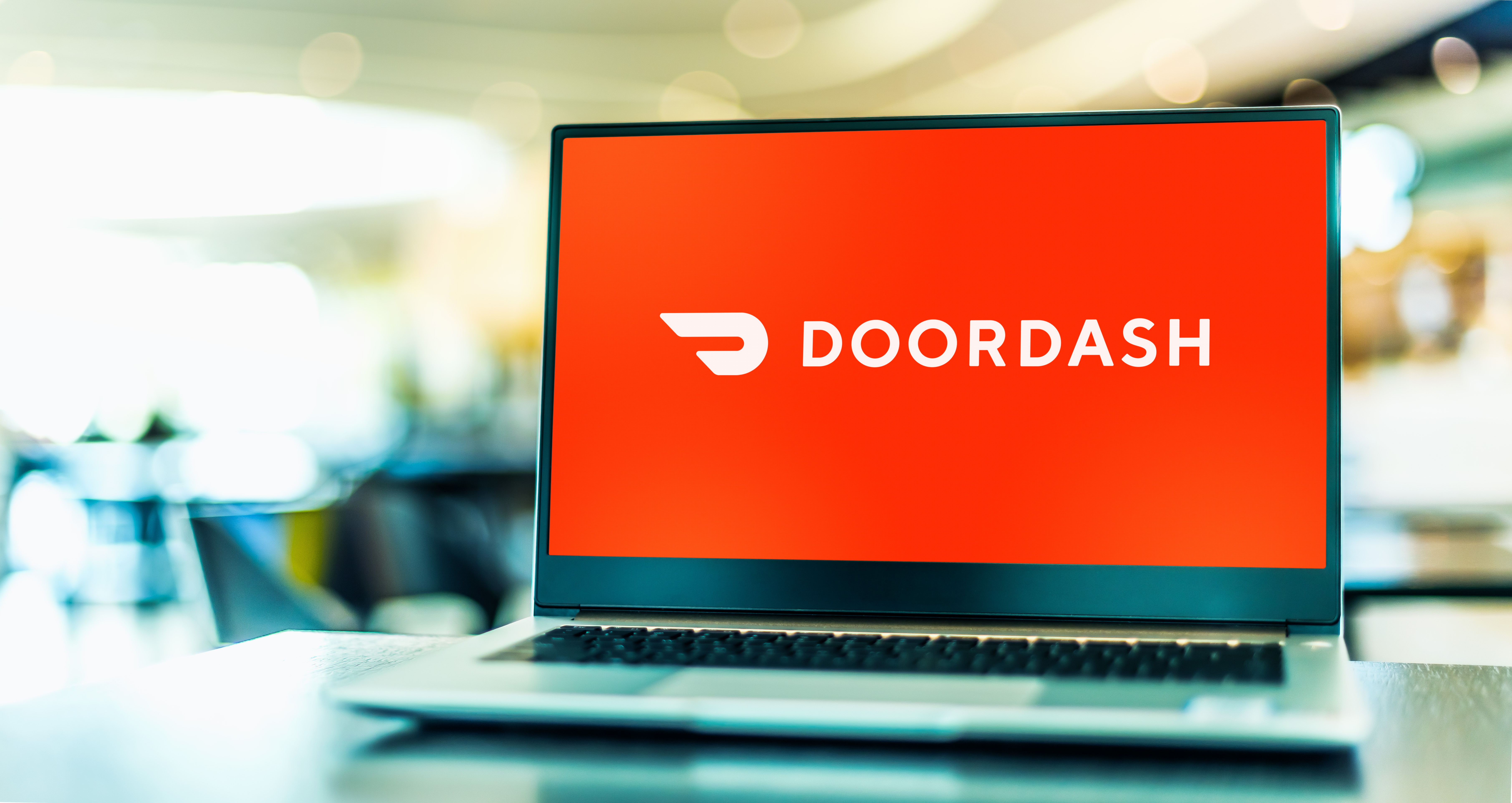 POZNAN, POL - OCT 22, 2021: Laptop computer displaying logo of DoorDash, Inc., an online food ordering and food delivery platform,  based in San Francisco, California, USA