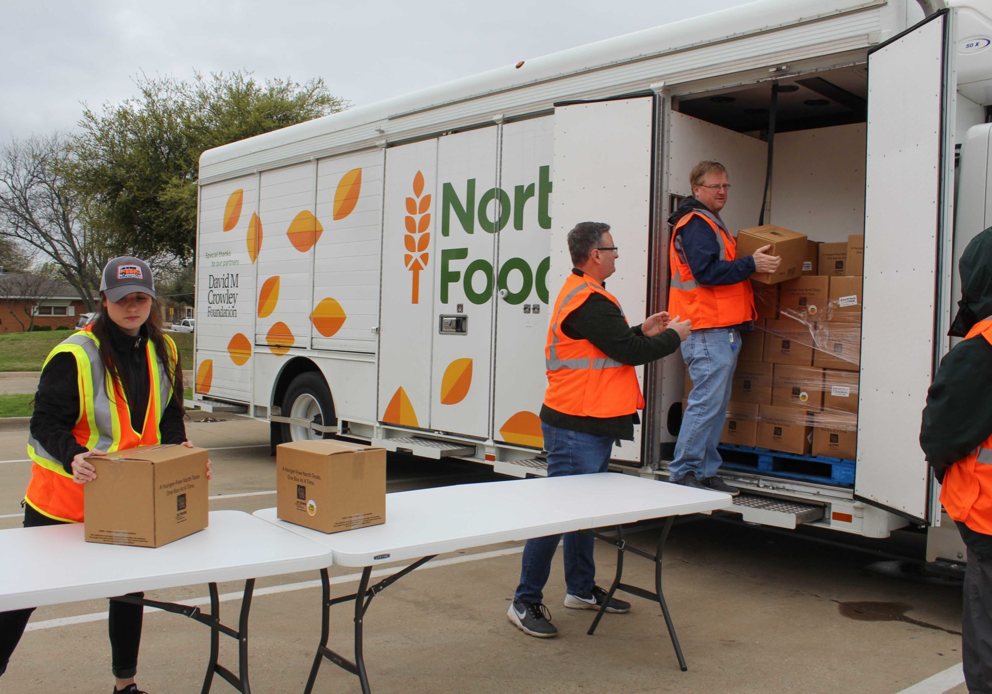 Food Bank staff unloading food from a mobile pantry truck