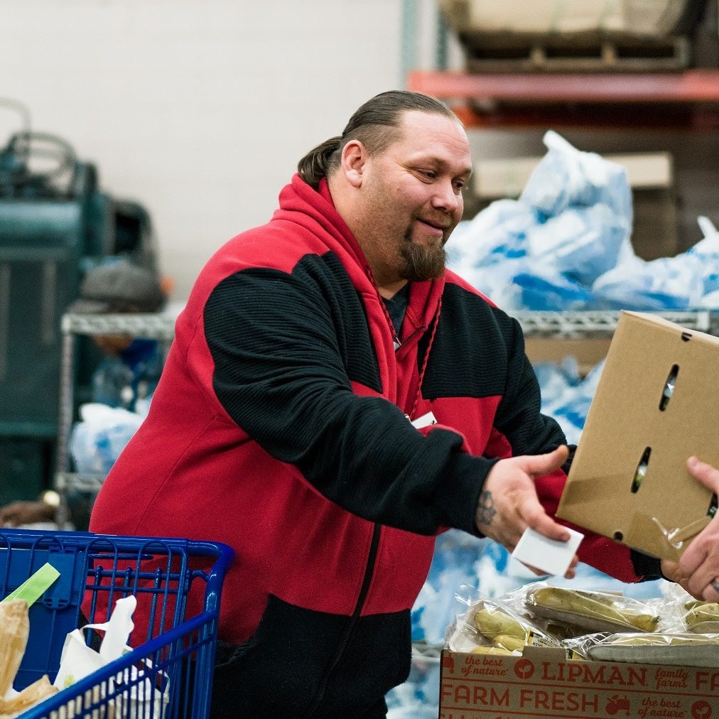 Man Receiving Box Of Food